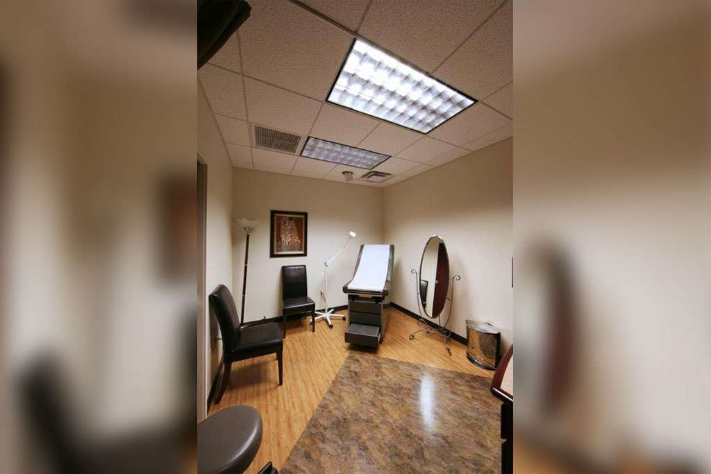 office - consult room with mirror and chair